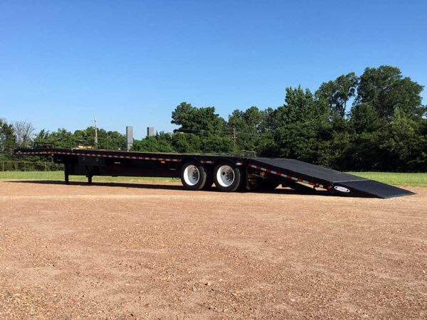 Hydraulic tail trailer with tilting main deck